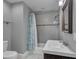 Renovated bathroom with modern vanity, shower with new tiling and rainfall showerhead at 613 Daniels Ave, Orlando, FL 32801
