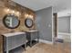 This bathroom features double sinks and a shower with tile accents at 613 Daniels Ave, Orlando, FL 32801