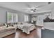 Bedroom with lots of natural light, dark floors, a loveseat, and neutral paint at 613 Daniels Ave, Orlando, FL 32801