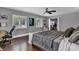 Comfortable bedroom with wooden floors, a ceiling fan, and natural light at 613 Daniels Ave, Orlando, FL 32801