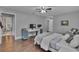 Bright bedroom featuring hardwood floors, white trim, and neutral paint with a modern desk at 613 Daniels Ave, Orlando, FL 32801