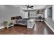 This bedroom features a ceiling fan, windows with shutters, and a wooden floor at 613 Daniels Ave, Orlando, FL 32801