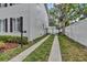 Gated driveway and side yard showing the access and boundary of the property at 613 Daniels Ave, Orlando, FL 32801