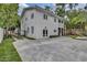 The backyard features a patio, balcony, and a well-manicured lawn at 613 Daniels Ave, Orlando, FL 32801