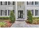 Close-up of the entrance, featuring a glass double door framed by white columns at 613 Daniels Ave, Orlando, FL 32801