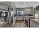 Modern kitchen with stainless steel appliances and fixtures, light grey cabinets, and hardwood floors at 613 Daniels Ave, Orlando, FL 32801