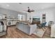 Open-concept living room with hardwood floors, neutral colors, and comfortable seating at 613 Daniels Ave, Orlando, FL 32801