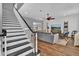 Spacious living room with hardwood floors, a ceiling fan, and stylish decor at 613 Daniels Ave, Orlando, FL 32801