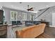 Bright living room with hardwood floors, natural light, and comfortable seating at 613 Daniels Ave, Orlando, FL 32801