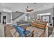 Spacious living room with staircase, hardwood floors, and a view into the kitchen at 613 Daniels Ave, Orlando, FL 32801