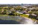Stunning aerial view of the recreational area and water with a backdrop of city skyline and lush green trees at 6301 Parson Brown Dr, Orlando, FL 32819
