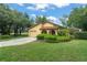 Charming yellow home with well-manicured lawn and landscaping at 6301 Parson Brown Dr, Orlando, FL 32819