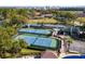 Aerial view of tennis courts in a lush, green setting at 6301 Parson Brown Dr, Orlando, FL 32819