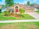 Charming single-story home with well-manicured lawn and colorful landscaping at 677 Cheoy Lee Cir, Winter Springs, FL 32708