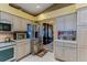 Well-appointed kitchen features stainless steel appliances, ample cabinet space, and a view to the dining room at 677 Cheoy Lee Cir, Winter Springs, FL 32708