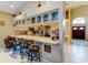 Open-concept kitchen featuring a breakfast bar with seating and views into the entryway at 677 Cheoy Lee Cir, Winter Springs, FL 32708