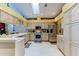 Spacious kitchen with stainless steel appliances, abundant cabinetry, and a bright, airy feel at 677 Cheoy Lee Cir, Winter Springs, FL 32708