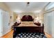 Main bedroom featuring a king-sized bed and an elegant furniture set at 677 Cheoy Lee Cir, Winter Springs, FL 32708