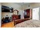 Spacious main bedroom with a king-sized bed and en-suite bathroom at 677 Cheoy Lee Cir, Winter Springs, FL 32708