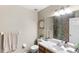 This is a bathroom with a mirror, a vanity, and a towel rack at 7823 Baron Ave, Howey In The Hills, FL 34737