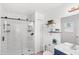 This is a bathroom with a tile shower, white toilet, and blue vanity at 7823 Baron Ave, Howey In The Hills, FL 34737