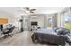 This is a bedroom with hardwood floors, a ceiling fan, and natural light from the windows at 7823 Baron Ave, Howey In The Hills, FL 34737