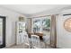 Charming dining area with an antique china cabinet and view of the backyard at 7823 Baron Ave, Howey In The Hills, FL 34737