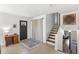 Bright entryway with tile flooring, stairs, and a stylish front door at 7823 Baron Ave, Howey In The Hills, FL 34737