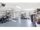 Spacious three car garage featuring storage shelves and room for parking and hobbies at 7823 Baron Ave, Howey In The Hills, FL 34737