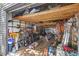 Storage shed filled with equipment, tools, and supplies with an overhead storage area at 7823 Baron Ave, Howey In The Hills, FL 34737