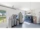 Bright laundry room features new machines and water filtration system for the home at 7823 Baron Ave, Howey In The Hills, FL 34737
