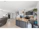 Open-concept kitchen and living area with an island and modern finishes at 7823 Baron Ave, Howey In The Hills, FL 34737