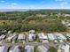 Aerial view of the property highlighting the location and surrounding community at 8 Cocos Plumosa Dr # A, Eustis, FL 32726