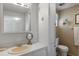 Bathroom featuring light brown walls, matching vanity and a medicine cabinet at 8 Cocos Plumosa Dr # A, Eustis, FL 32726
