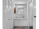 Bathroom features a vanity with storage and a large mirror at 8 Cocos Plumosa Dr # A, Eustis, FL 32726