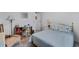 Comfortable bedroom with a spacious bed and a desk area near the wall at 8 Cocos Plumosa Dr # A, Eustis, FL 32726