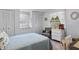 Cozy bedroom featuring comfortable bed, dresser, and plenty of closet space at 8 Cocos Plumosa Dr # A, Eustis, FL 32726