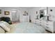 Comfortable main bedroom featuring dressers and ensuite bathroom at 8 Cocos Plumosa Dr # A, Eustis, FL 32726