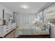 Inviting main bedroom featuring light and bright furnishings and lots of natural light at 8 Cocos Plumosa Dr # A, Eustis, FL 32726
