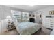 Comfortable bedroom with matching bedside table and dresser, plus ensuite bathroom at 8 Cocos Plumosa Dr # A, Eustis, FL 32726
