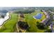 Scenic aerial view of a community located on a pristine golf course with mature landscaping at 9423 Myrtle Creek Ln # 510, Orlando, FL 32832