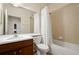 Bathroom featuring a tub and shower, white toilet, and wooden vanity with a sink at 9423 Myrtle Creek Ln # 510, Orlando, FL 32832