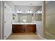 Modern bathroom with a double sink vanity and a glass-enclosed shower at 9423 Myrtle Creek Ln # 510, Orlando, FL 32832