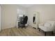 Bedroom with a desk, armoire and comfortable chair near a window with natural light at 9423 Myrtle Creek Ln # 510, Orlando, FL 32832
