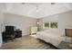 Bedroom with vaulted ceiling, a large window, light walls, and wood laminate flooring at 9423 Myrtle Creek Ln # 510, Orlando, FL 32832