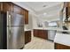 Modern kitchen with stainless steel appliances and white countertops at 9423 Myrtle Creek Ln # 510, Orlando, FL 32832