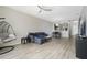 Inviting living area with hardwood floors, ceiling fan, and modern décor at 9423 Myrtle Creek Ln # 510, Orlando, FL 32832