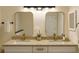 Modern bathroom with double sinks, granite countertops, white cabinets, and gold fixtures at 101 Dovetail Ct, Apopka, FL 32703