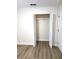 Bright bedroom with wood-look flooring and closet with bi-fold doors at 101 Dovetail Ct, Apopka, FL 32703