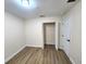 Bright bedroom with wood-look flooring and closet with bi-fold doors at 101 Dovetail Ct, Apopka, FL 32703